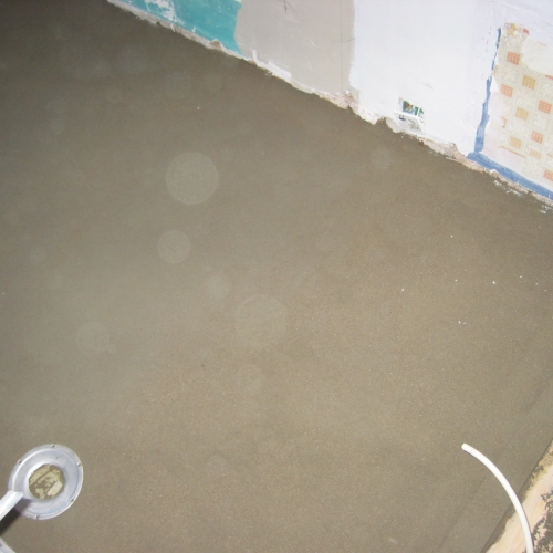 Ny betonafretningslag i badeværelsesrenovering i København